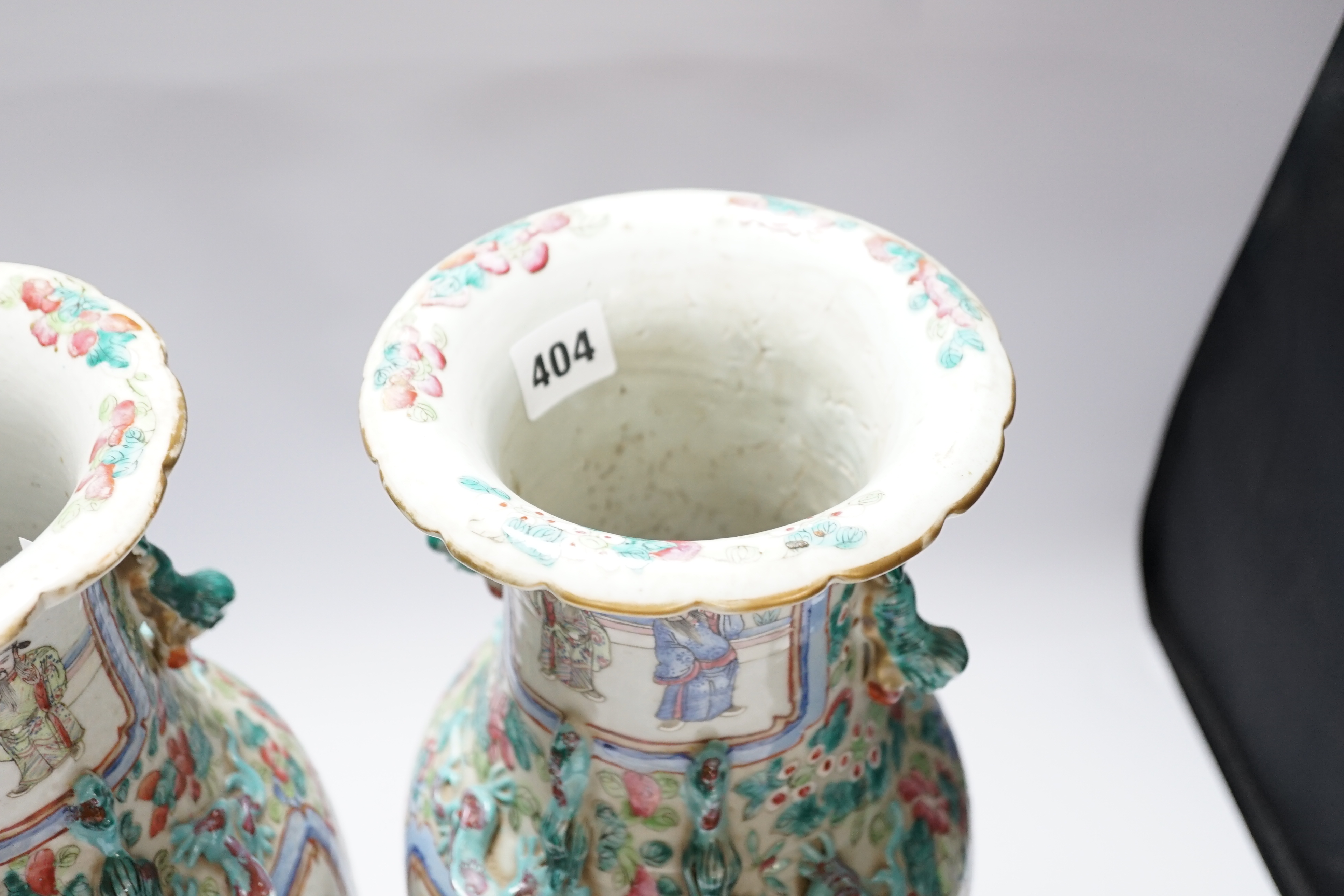 A pair 19th century Chinese famille rose ‘warriors’ baluster vases and stands, 39cm high including stands